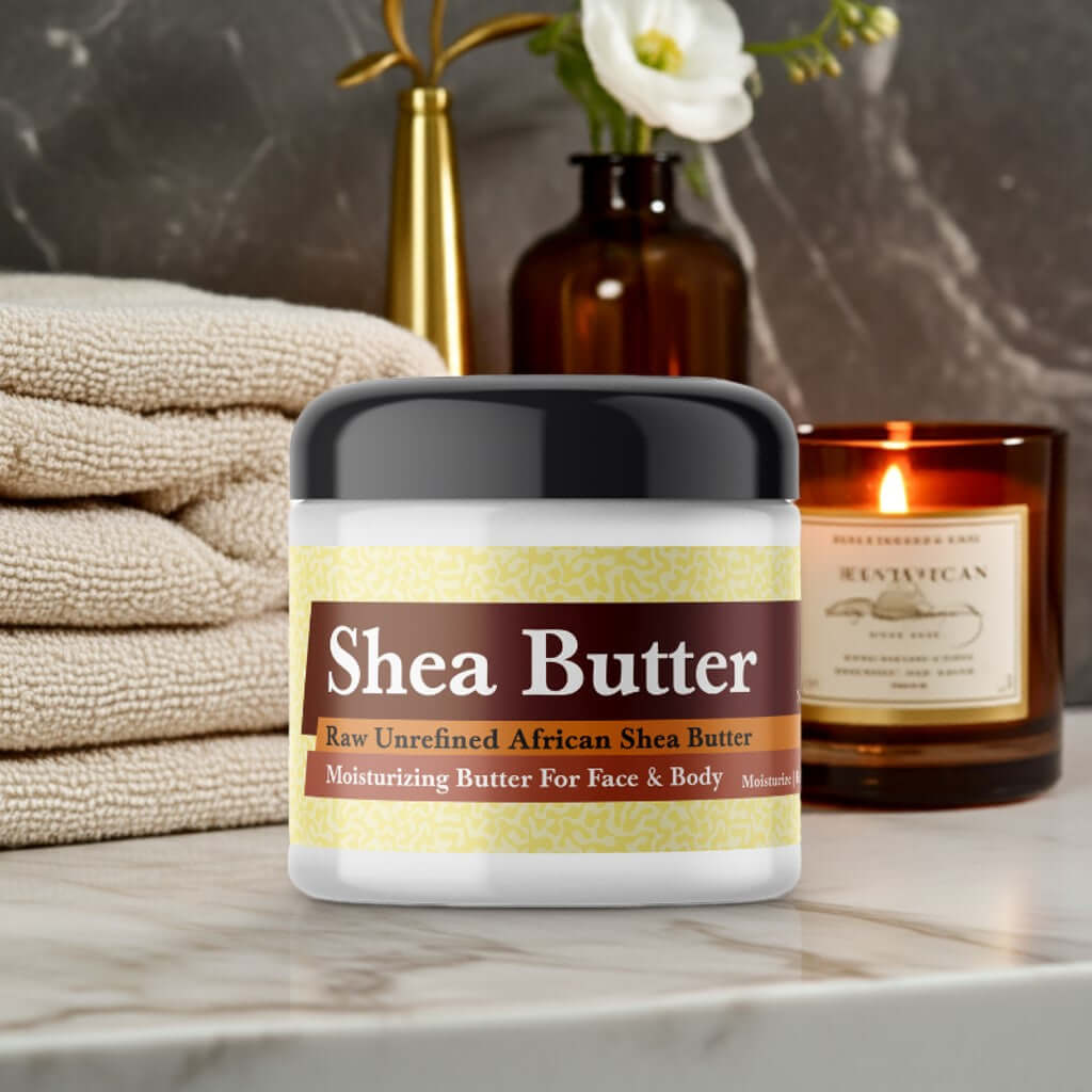 Mary J Blige Inspired Scented Shea Butter in a jar on a spa-like setting with a candle and flowers in the background.