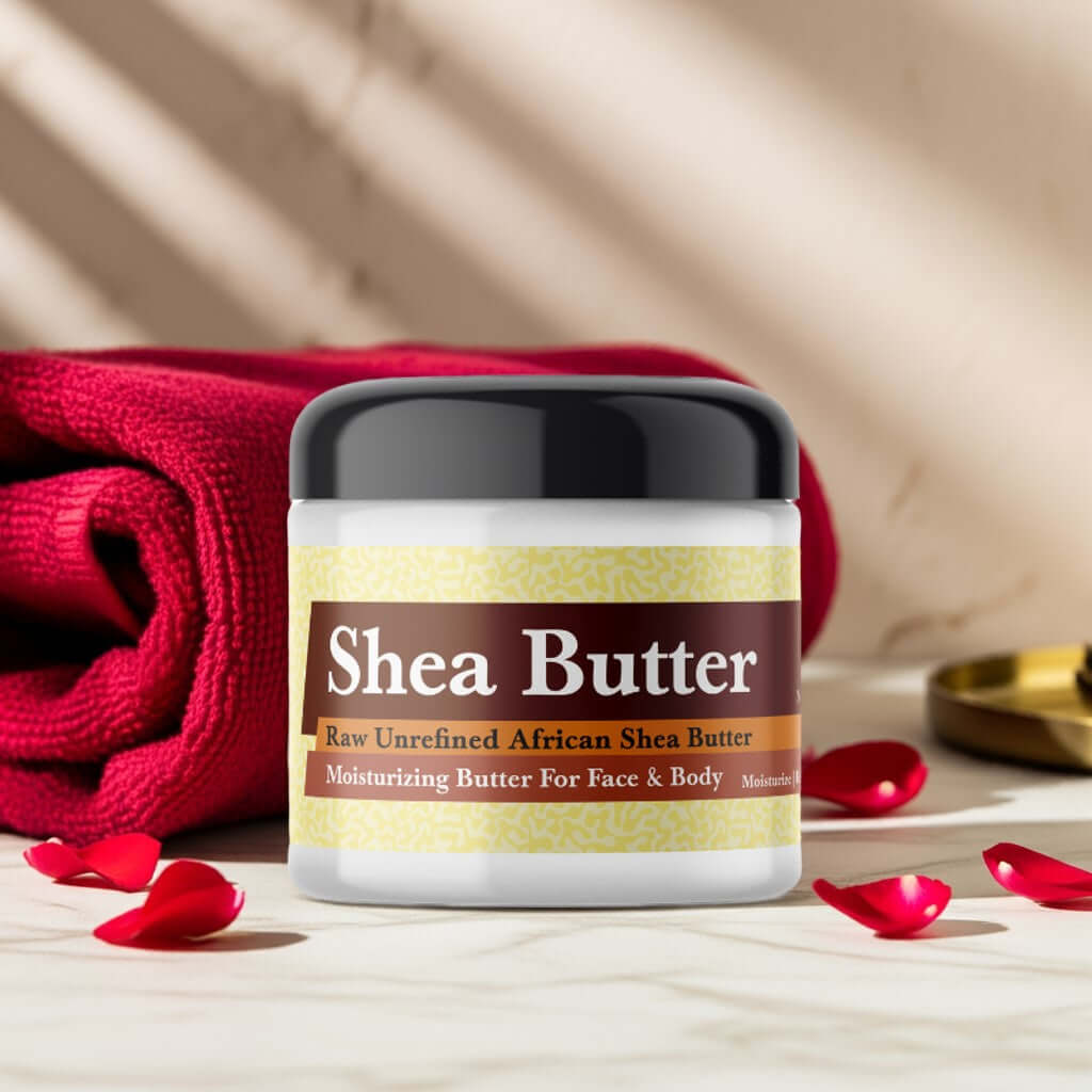 Somalian Rose Scented Shea Butter jar with rose petals and red towel background.