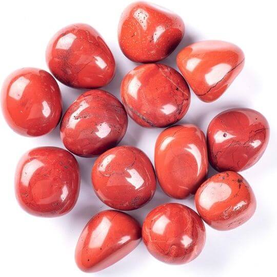 Genuine Red Jasper tumbled stones showcasing their vibrant hues, healing properties, and spiritual meaning.