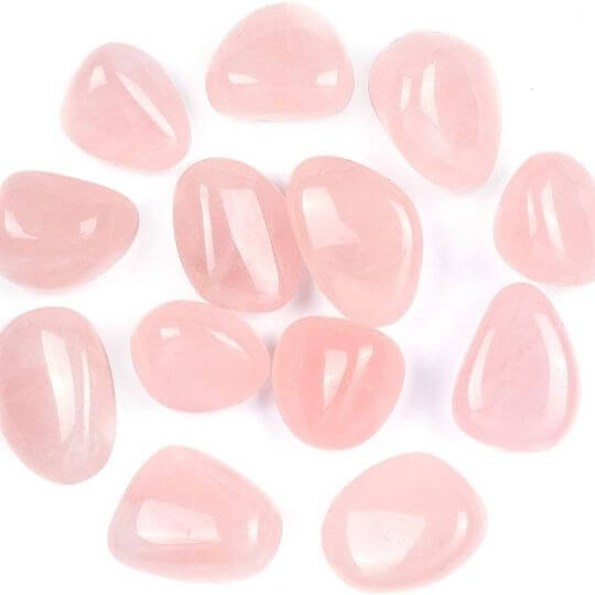 Polished Rose Quartz tumbled stones showcasing their soft pink hues and healing properties.