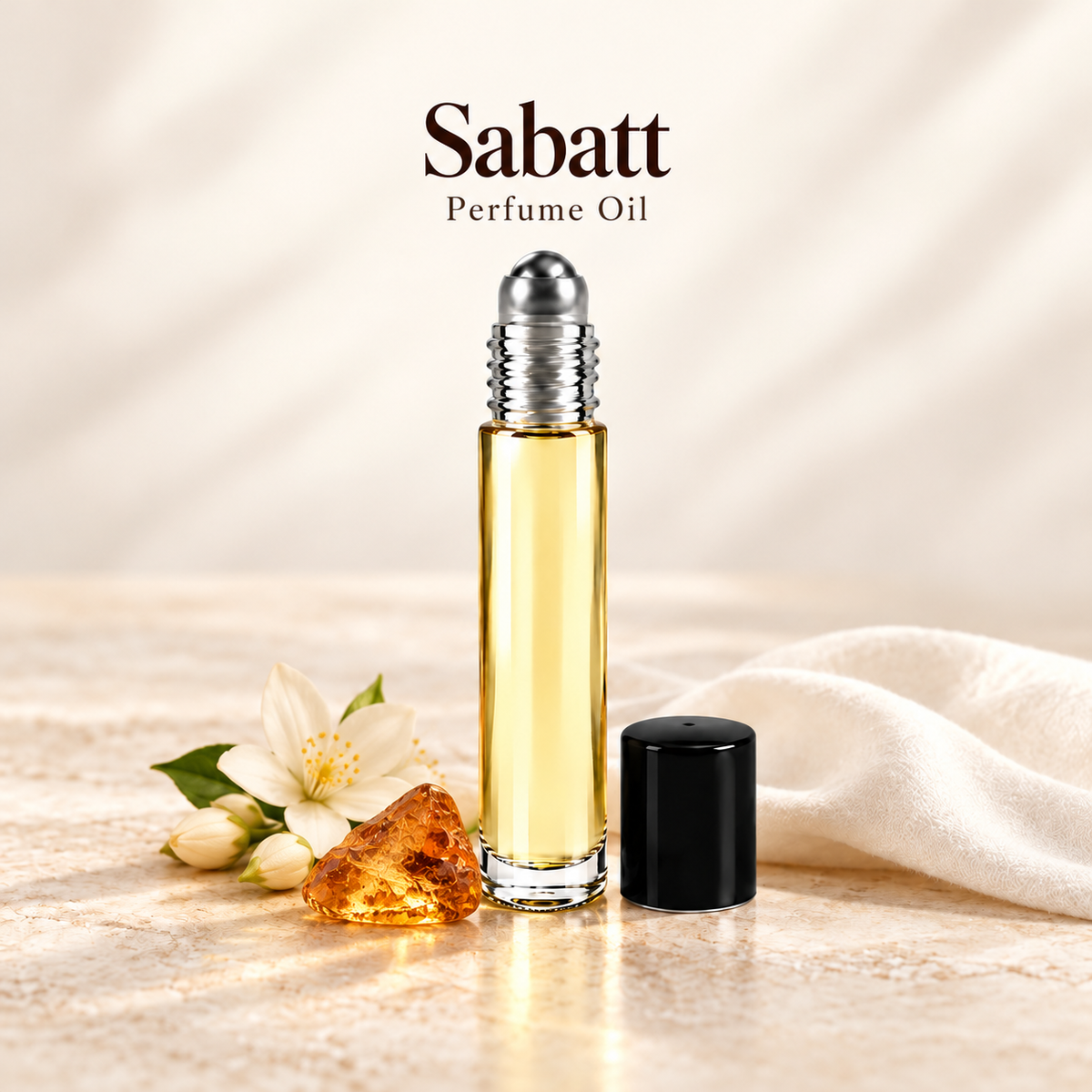 Sabatt Perfume Oil with simple scent note accents on soft ivory