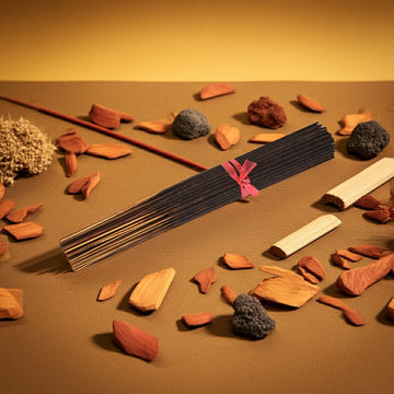 Sandalwood Incense Sticks on a brown background with wood and wood pieces around