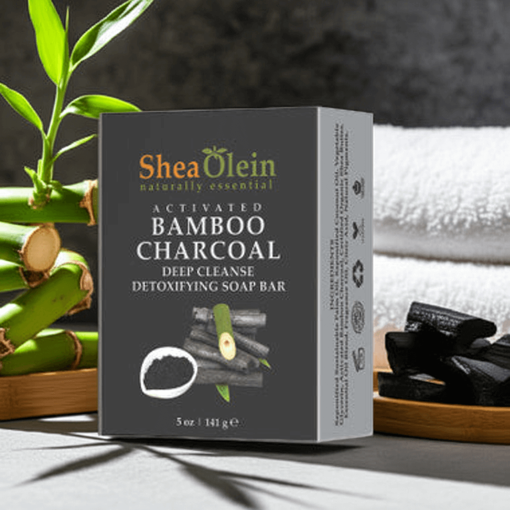 Shea Olein Activated Bamboo Charcoal Soap, detoxifying soap bar with bamboo and coconut oil, 5 oz box on display.