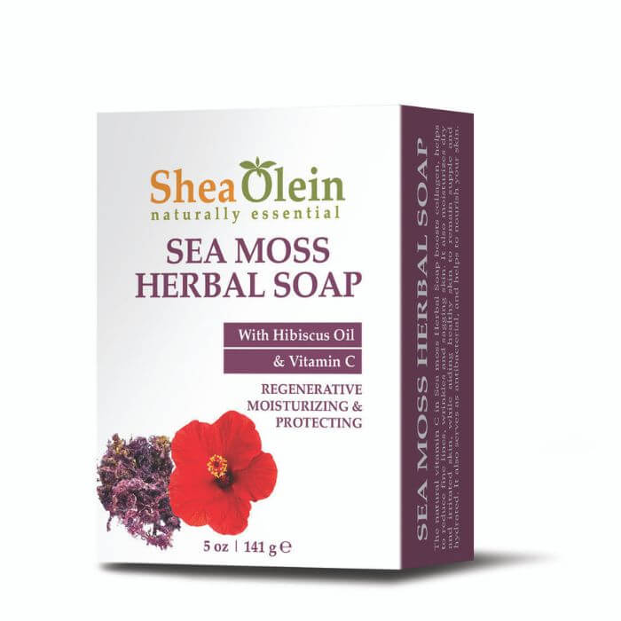 Shea Olein Sea Moss Herbal Soap displayed with hibiscus flower, sea moss, and citrus slices on a natural stone surface with a tropical botanical background.