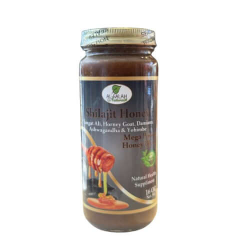 Shilajit Herbal Honey 16 oz. jar with honey dipper, herbs, and spices in natural setting
