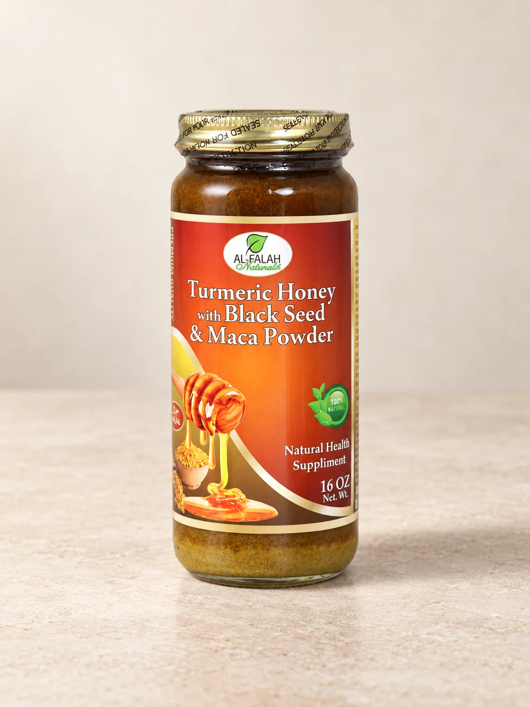 Turmeric Black Seed & Maca Honey 16 oz product packaging on a warm ivory background