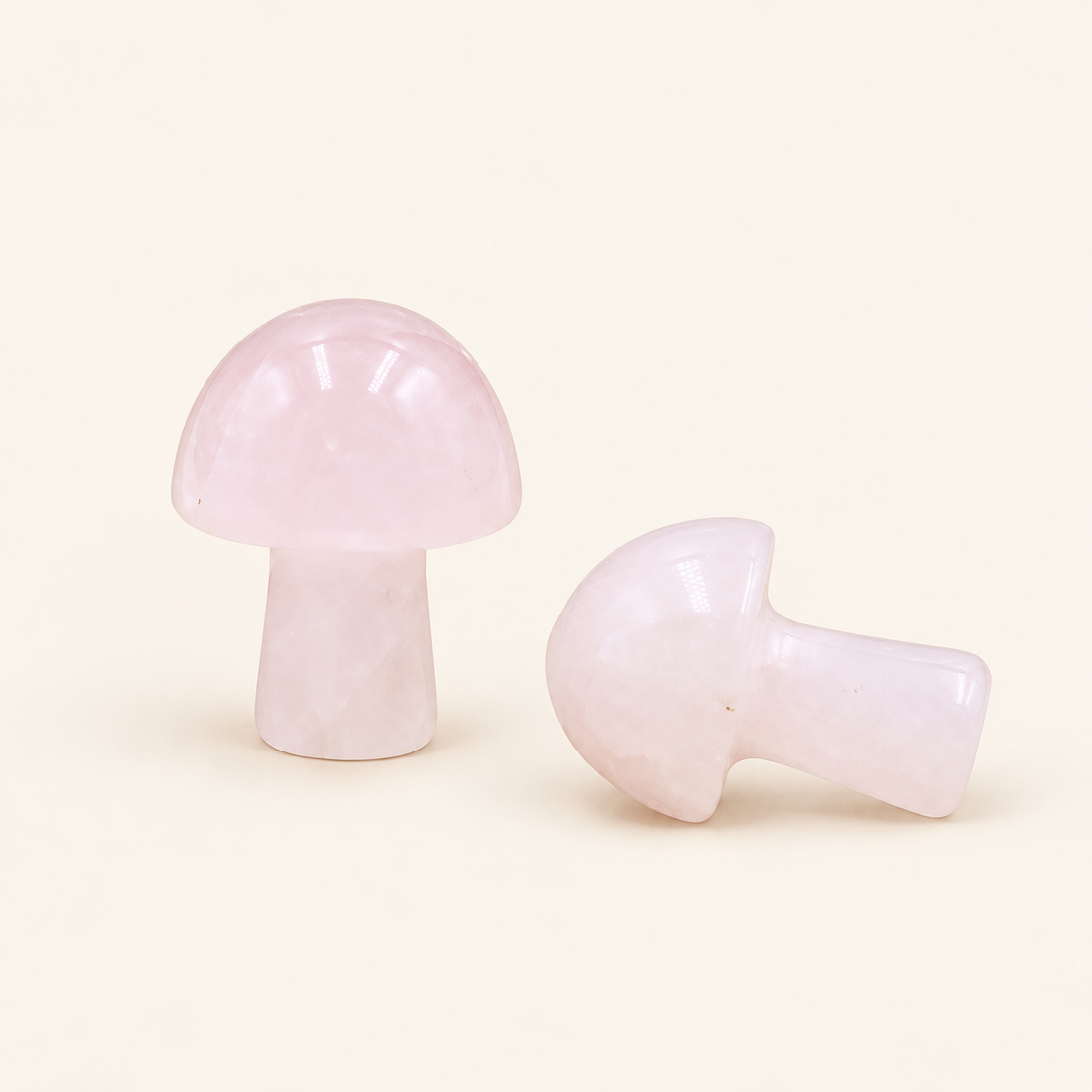 Rose Quartz Carved Mushroom with soft pink tones on a soft ivory background