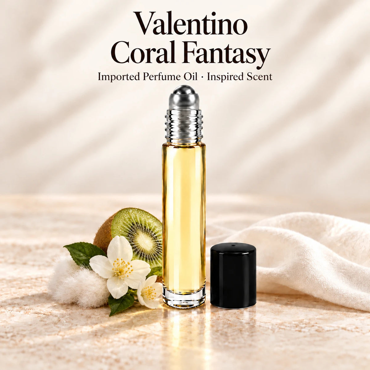 Valentino Coral Fantasy Perfume Oil in a slim glass roll-on bottle with a silver roller and black cap on an ivory stone surface.
