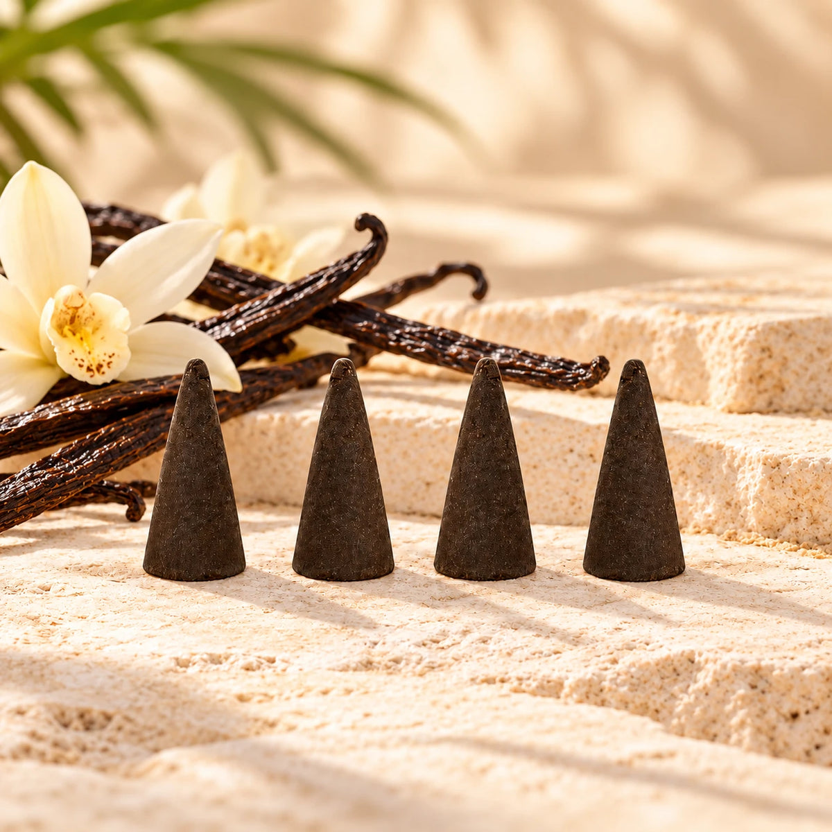 Vanilla Bean Incense Cones with vanilla pods and flowers.