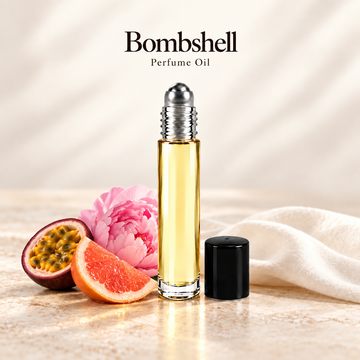 Victoria's Secret Bombshell Perfume Oil with simple scent note accents on soft ivory