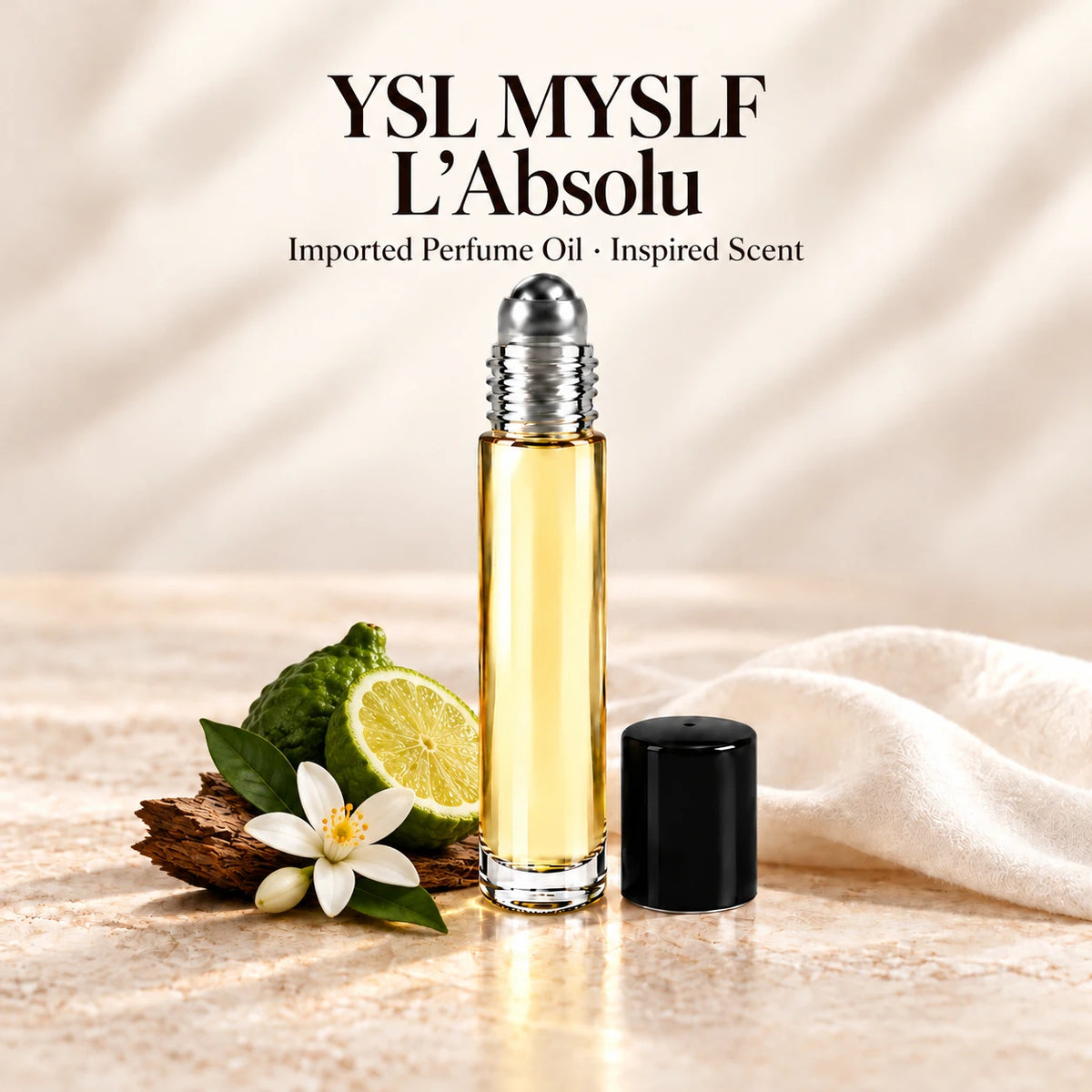 YSL MYSLF L'Absolu Perfume Oil in a slim glass roll-on bottle with a silver roller and black cap on an ivory stone surface.